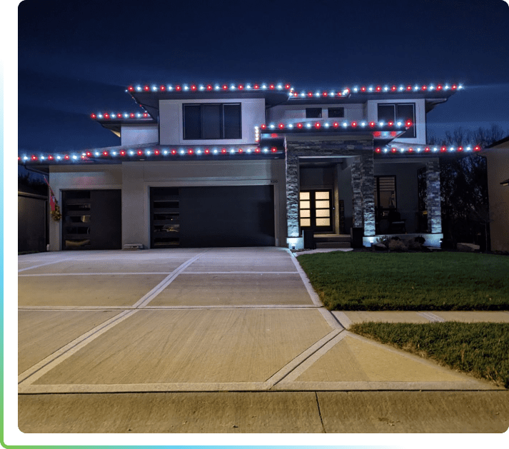 A house with lights on the roof and driveway.